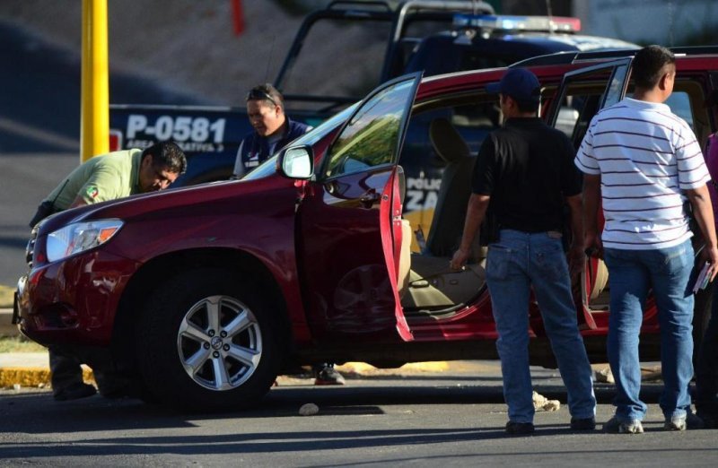 El vehículo del secretario de turismo tenía 13 impactos de bala. 